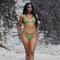 Scarlet, Tie Side Bikini Bottoms - Matcha on a model at the beach, showcasing cheeky coverage and high-cut fit.