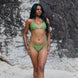 Scarlet, Tie Side Bikini Bottoms - Matcha on a model at the beach, showcasing cheeky coverage and high-cut fit.