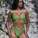 Bea, Brazilian Bikini Bottoms - Matcha on a model at the beach, showcasing high-rise and cheeky design.