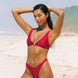 Girl wearing cherry red bikini set