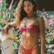Girl wearing cherry red double strap bikini bottoms