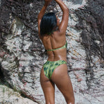 Isa Bikini Bottoms - Aurora on a model showcasing green bikini bottoms with high-cut leg and flattering silhouette.