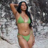 Sophie, Triangle Bikini Top -  Matcha on a model at the beach with a natural background, showcasing adjustable straps and stylish design.