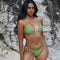 Sophie, Triangle Bikini Top -  Matcha worn by model on a beach, showcasing adjustable halter tie straps and removable cup padding.