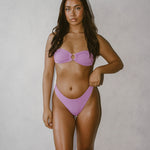 Isa Bikini Bottoms - Blush, showcasing elegant high rise and high leg cut for a flattering silhouette in lavender.