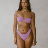 Isa Bikini Bottoms - Blush on model showcasing elegant style and high leg cut for flattering look.
